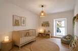 This charming nursery offers a serene and inviting space for your little one.