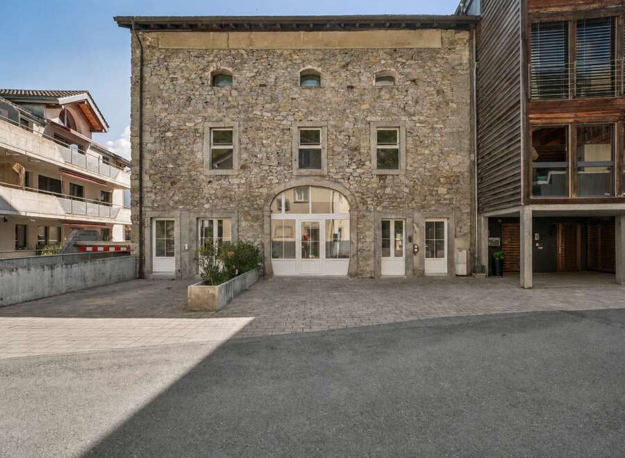 Discover this stunning property featuring a unique stone facade and modern design elements.