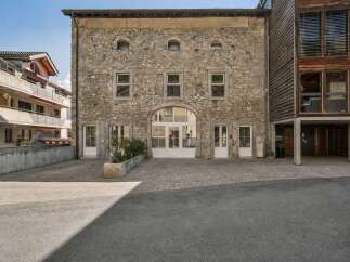 Discover this stunning property featuring a unique stone facade and modern design elements.