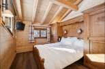 Experience rustic charm in this cozy bedroom.