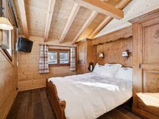 Experience rustic charm in this cozy bedroom.