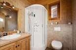 This charming bathroom boasts a rustic aesthetic, perfect for a cozy retreat.