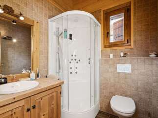 This charming bathroom boasts a rustic aesthetic, perfect for a cozy retreat.