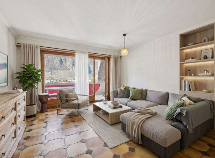 This stunning living space offers breathtaking mountain views, creating a serene and inviting atmosphere.