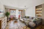 This stunning living space offers breathtaking mountain views, creating a serene and inviting atmosphere.
