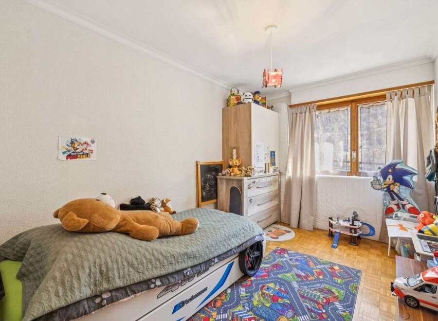 This charming bedroom features a playful design, perfect for a child's sanctuary.