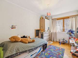 This charming bedroom features a playful design, perfect for a child's sanctuary.