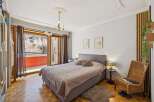 This inviting bedroom boasts a cozy atmosphere with a comfortable bed and stylish decor.
