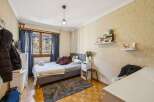 Discover this cozy bedroom featuring a comfortable bed, perfect for relaxation.