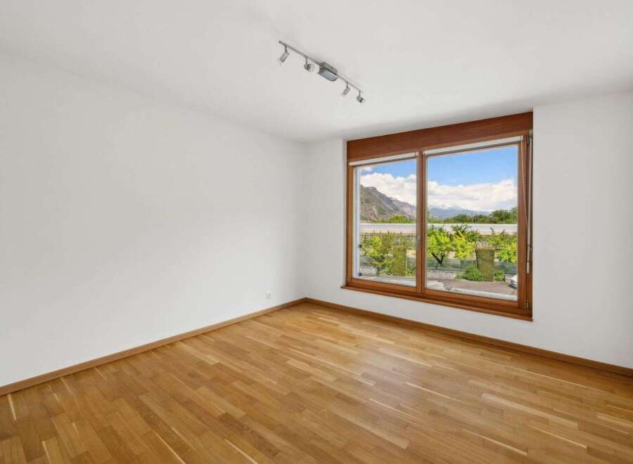 This bright and airy room features stunning views through large windows.