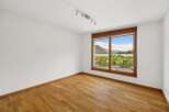 This bright and airy room features stunning views through large windows.