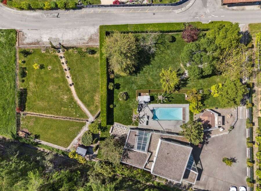 Discover a stunning property featuring a luxurious pool and meticulously landscaped grounds.