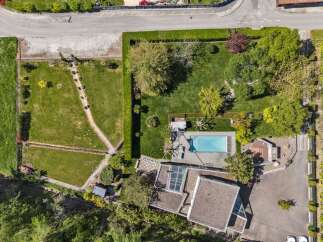 Discover a stunning property featuring a luxurious pool and meticulously landscaped grounds.