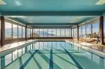 Experience luxury and tranquility in this stunning indoor pool with breathtaking views.