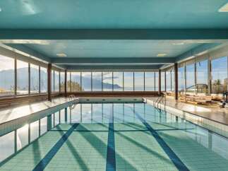Experience luxury and tranquility in this stunning indoor pool with breathtaking views.