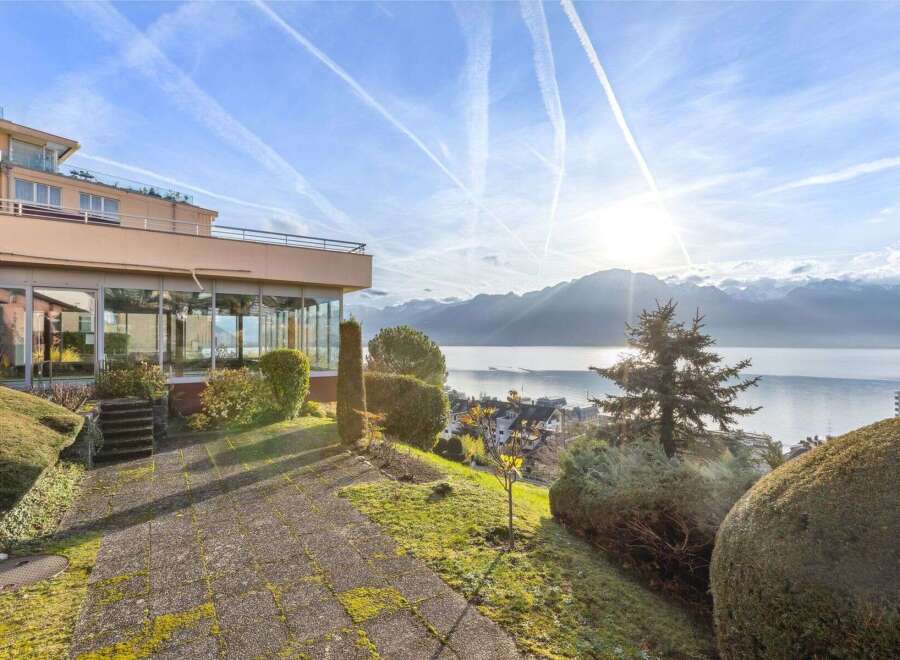 Experience breathtaking views from this stunning property, featuring a modern design and expansive windows.