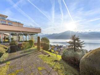 Experience breathtaking views from this stunning property, featuring a modern design and expansive windows.