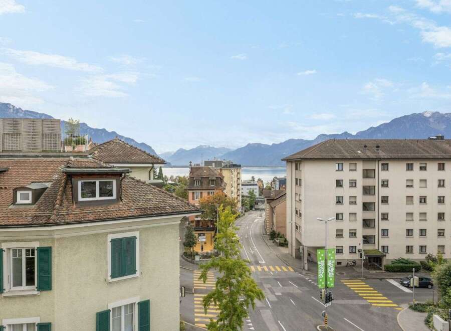 Discover stunning views from this property, offering a picturesque cityscape with majestic mountains in the background.