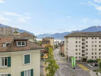 Discover stunning views from this property, offering a picturesque cityscape with majestic mountains in the background.