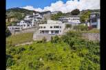 Discover a stunning hillside property with modern architecture and breathtaking views.