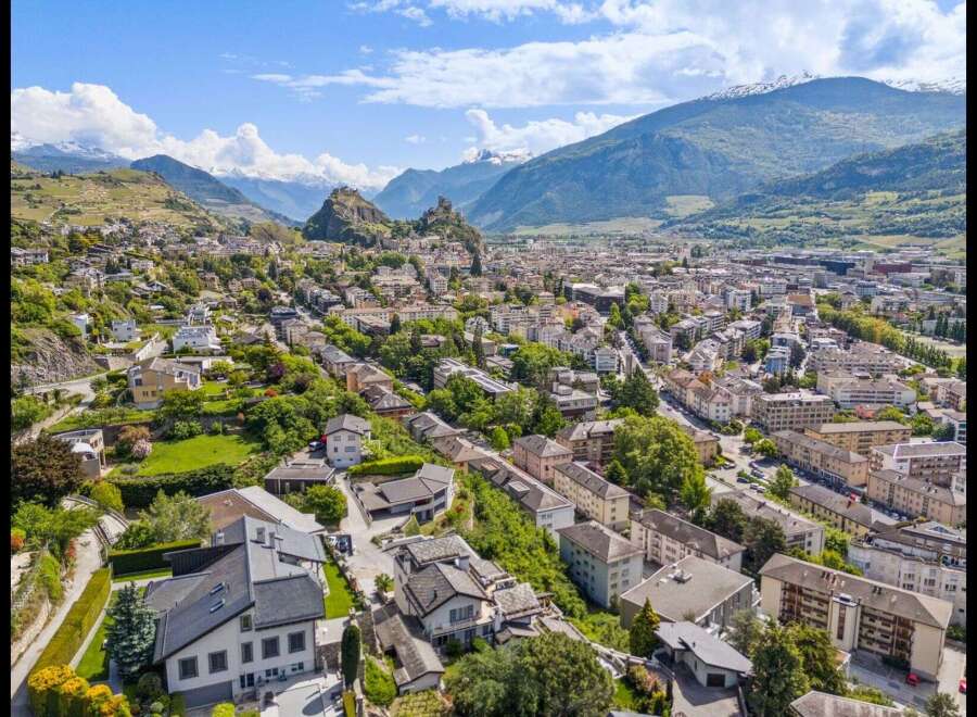 Discover breathtaking views and a charming cityscape in this stunning aerial shot.