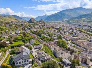 Discover breathtaking views and a charming cityscape in this stunning aerial shot.