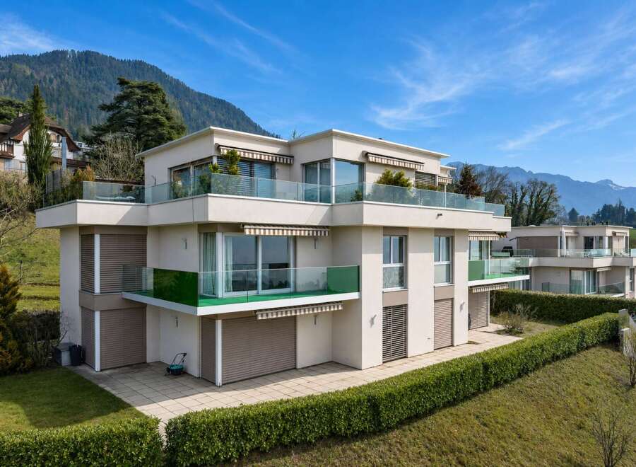 Discover modern luxury in this stunning property, featuring sleek architecture and expansive glass balconies.