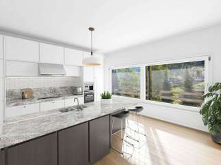 This stunning kitchen boasts a modern design with sleek white cabinetry and a beautiful marble countertop.