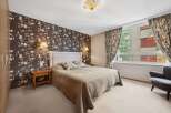 This inviting bedroom boasts a cozy ambiance, perfect for relaxation.