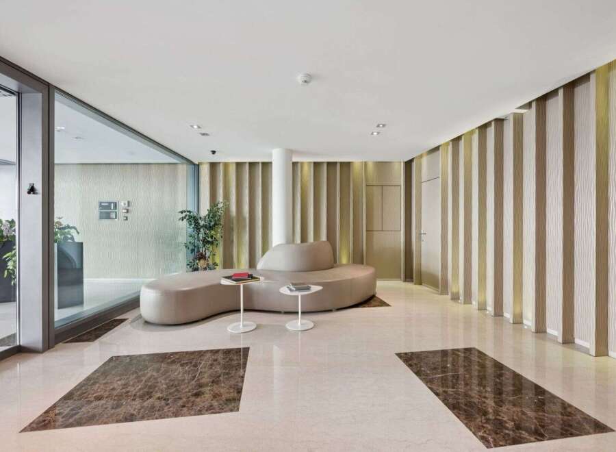 Step into luxury with this stunning property, showcasing a modern lobby design.
