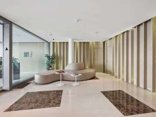 Step into luxury with this stunning property, showcasing a modern lobby design.