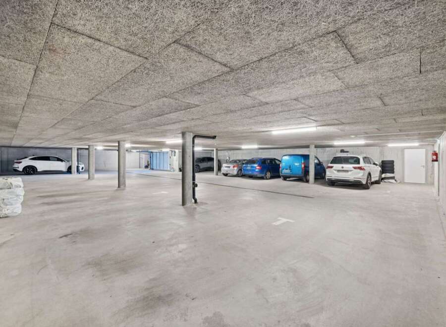 Discover this spacious and well-lit underground parking garage, perfect for secure vehicle storage.