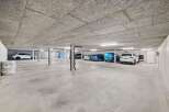 Discover this spacious and well-lit underground parking garage, perfect for secure vehicle storage.