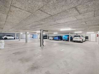 Discover this spacious and well-lit underground parking garage, perfect for secure vehicle storage.