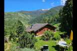 Escape to your dream home nestled in the heart of nature! This stunning property boasts a charming wooden house with a picturesque view of the mountains.