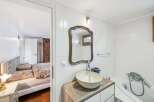 Discover this charming property featuring a well-appointed bathroom with a stylish sink and mirror.