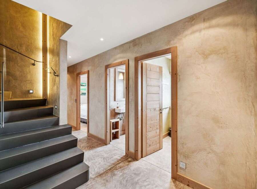 Step into luxury with this stunning property featuring a modern staircase and elegant hallway.