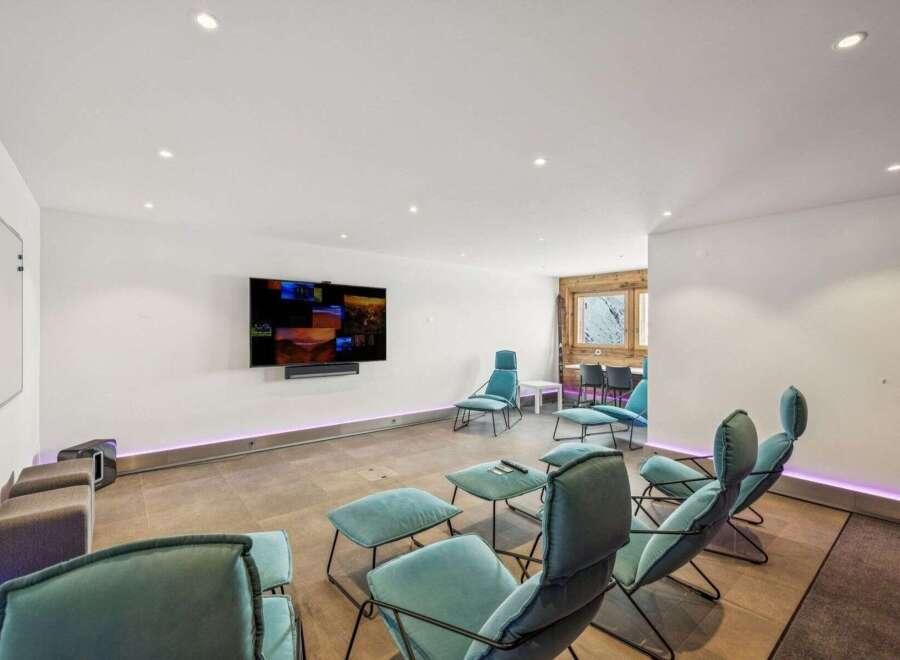 Experience modern luxury in this stunning property, featuring a spacious living area perfect for relaxation and entertainment.