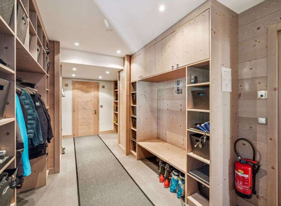 This stunning entryway boasts custom built-in storage solutions, perfect for organizing gear and maximizing space.