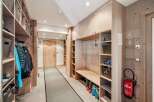 This stunning entryway boasts custom built-in storage solutions, perfect for organizing gear and maximizing space.