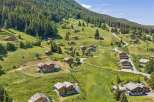 Nestled on a lush green mountainside, this charming village features traditional wooden chalets with stunning panoramic views.
