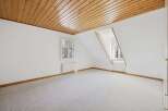 Discover the charm of this bright and airy room, featuring a stunning wooden ceiling that adds warmth and character.
