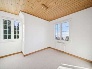 Discover the charm of this bright and airy room, featuring a beautiful wooden ceiling that adds warmth and character.