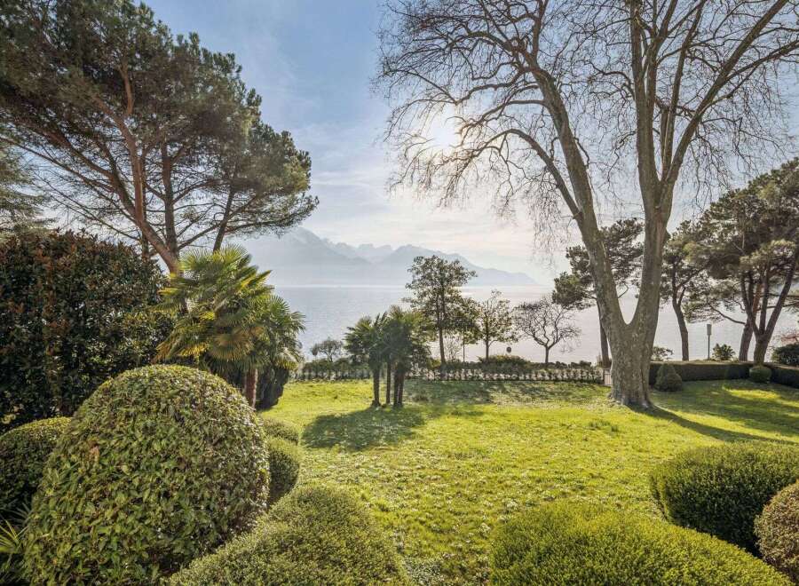 Experience the epitome of luxury living with this stunning property, boasting breathtaking views of the lake and surrounding mountains.