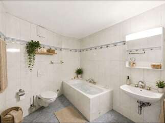 This well-maintained bathroom features a clean and modern design, perfect for relaxation.