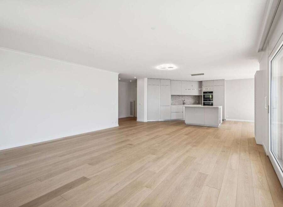 This stunning property boasts a modern, open-plan living space with beautiful hardwood floors.