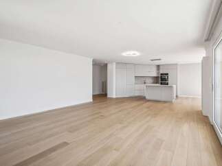 This stunning property boasts a modern, open-plan living space with beautiful hardwood floors.