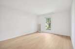 Discover the charm of this bright and airy room, featuring pristine white walls and elegant hardwood floors.
