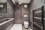 Step into modern luxury with this stunning bathroom design.