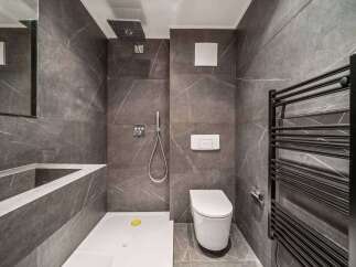 Step into modern luxury with this stunning bathroom design.